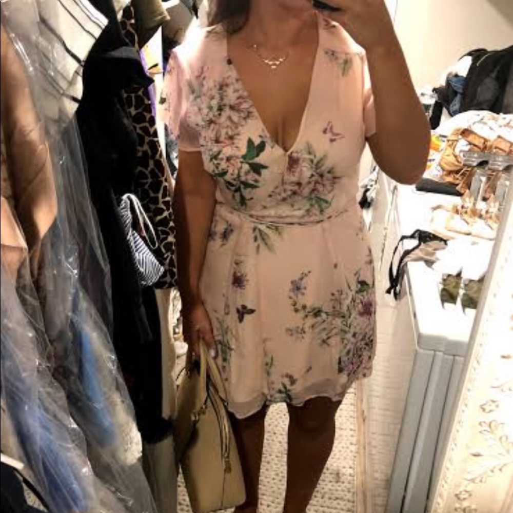 Blush toned floral flattering wrap dress!